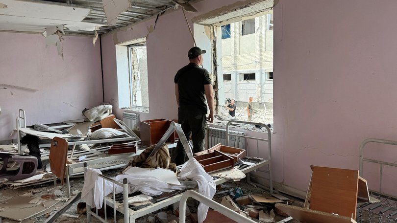 A Ukrainian law enforcement officer inside a destroyed building in a correctional colony hit in a Russian air attack in Bilenke, Zaporizhzhia.