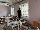 A Ukrainian law enforcement officer inside a destroyed building in a correctional colony hit in a Russian air attack in Bilenke, Zaporizhzhia.