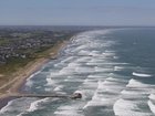 An aerial photo shows white waves crashing onto the Kujukuri Coast in Sosa City, Chiba Prefecture (Photo by Toshiyuki Kon / The Yomiuri Shimbun via AFP) 