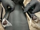 A dual citizen is facing court after 500g of heroin was allegedly found ‘oozing’ from his suitcase handles.