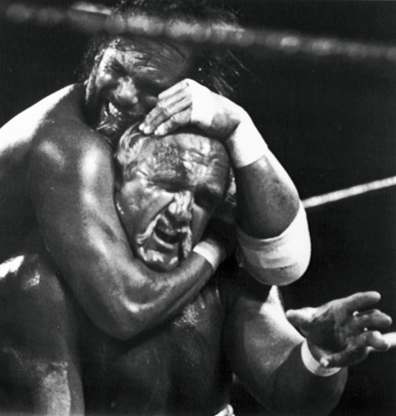  Randy "Macho Man" Savage, top, has challenger Hulk Hogan in a headlock during the main event for Wresltemania V.