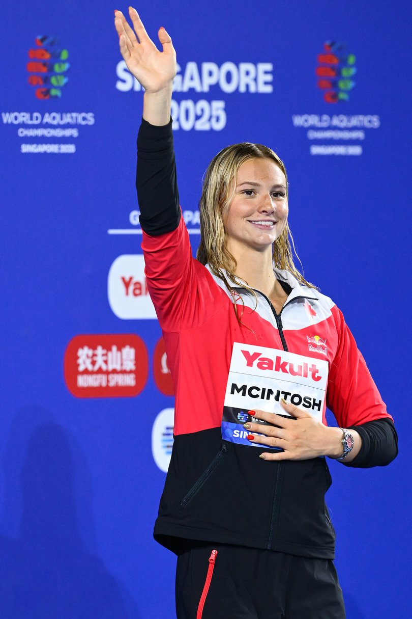 Summer McIntosh, 17, of Team Canada celebrates on the podium.