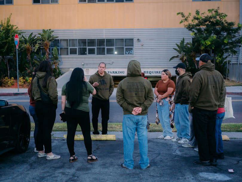 Ron Gochez and other volunteers with Union del Barrio at an early morning meet-up before patrolling.