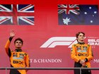 Oscar Piastri of Australia and McLaren and Second placed Lando Norris of Great Britain and McLaren celebrate on the podium during the F1 Grand Prix of Belgium.