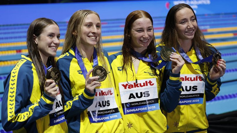 Mollie O'Callaghan and her teammates show off their 4x200m freestyle relay gold medals. (EPA PHOTO)