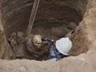 Archaeologist Jose Aliaga works at the site where city workers discovered ancient remains, from the pre-Inca Chancay culture.