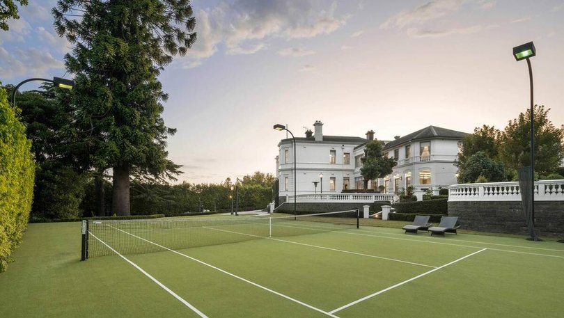 The flood-lit tennis court. Pic: Marshall White.