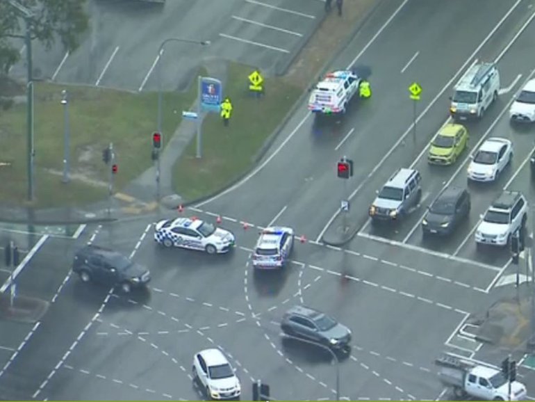 A 10-year-old child has been hit by a police car that was travelling under lights and sirens.