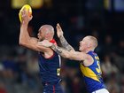Max Gawn of the Demons and Bailey J. Williams of the Eagles compete for the ball.