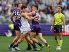 Lewis Young of the Blues and Patrick Voss of the Dockers wrestle before the first bounce.