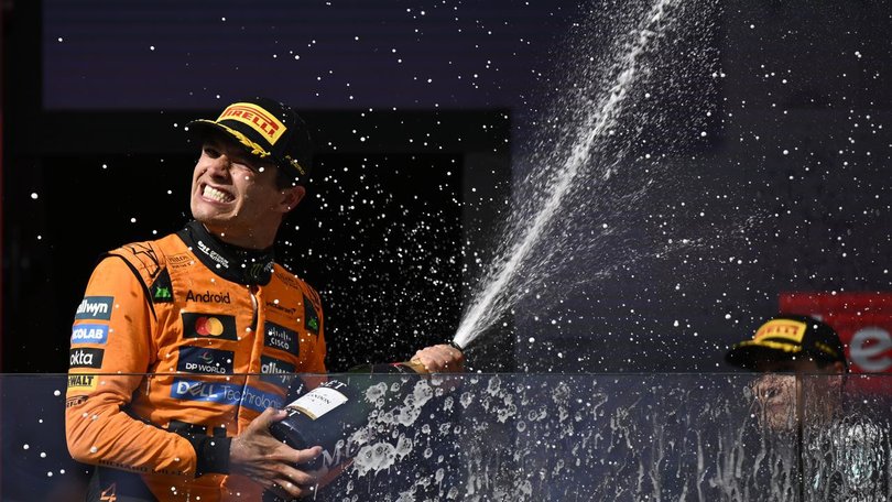 Lando Norris celebrates his hard-fought victory in Hungary. (AP PHOTO)