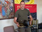 Artur Zahryviy, 38, head of Zviahel’s local district government council, holds a Russian FPV drone. 