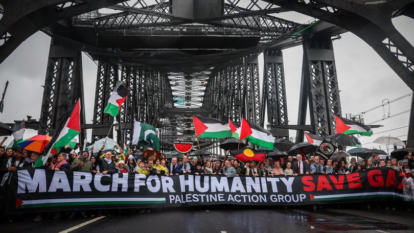 People march across the Harbour Bridge during the pro-Palestinian rally on August 03, 2025 in Sydney.