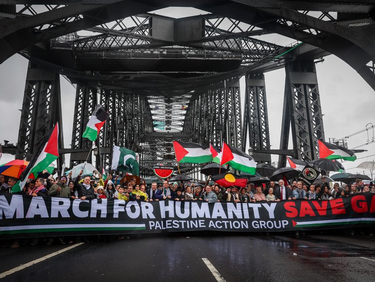 People march across the Harbour Bridge during the pro-Palestinian rally on August 03, 2025 in Sydney.