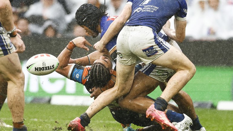 SYDNEY, AUSTRALIA - AUGUST 03: Stephen Crichton of the Bulldogs tackles Taylan May of the Tigers during the round 22 NRL match between Wests Tigers and Canterbury Bulldogs at CommBank Stadium, on August 03, 2025, in Sydney, Australia. (Photo by Mark Evans/Getty Images)