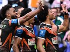 Tigers players appeared to taunt Bulldogs fans with the "khod" gesture after their victory. (Dan Himbrechts/AAP PHOTOS)