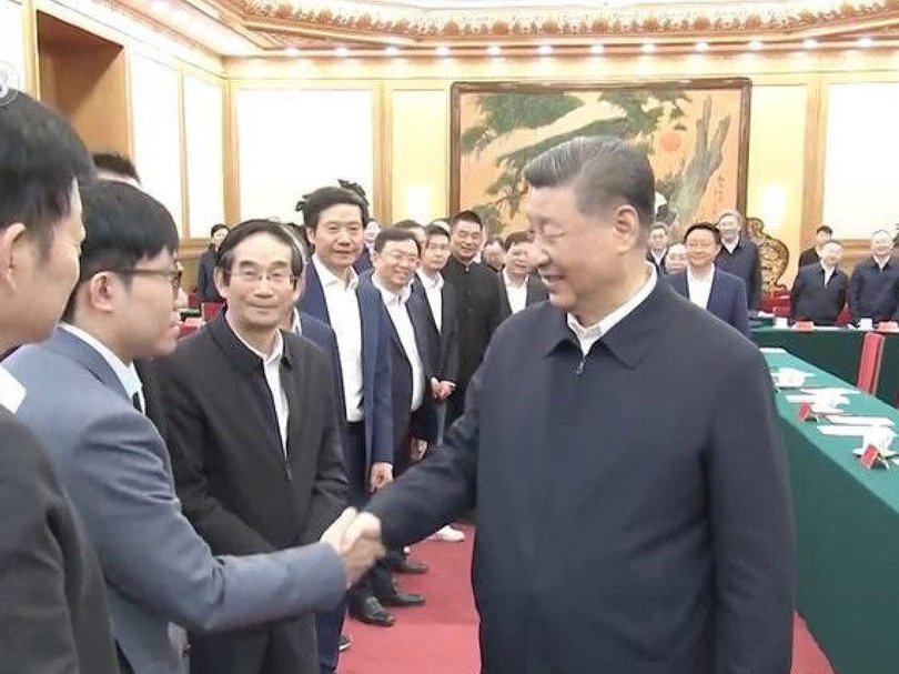 DeepSeek founder Liang Wenfeng shakes the hand of China leader Xi Jinping. 