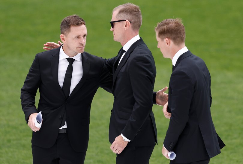 Joel Selwood, Adam Selwood and Scott Selwood embrace during Troy Selwood's Funeral Service at GMHBA Stadium on February 14, 2025 in Geelong.