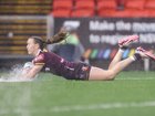 Tamika Upton of the Broncos scores a try in the horrific conditions. 