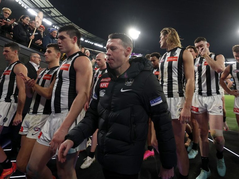 Collingwood walk off after the loss to Hawthorn. 