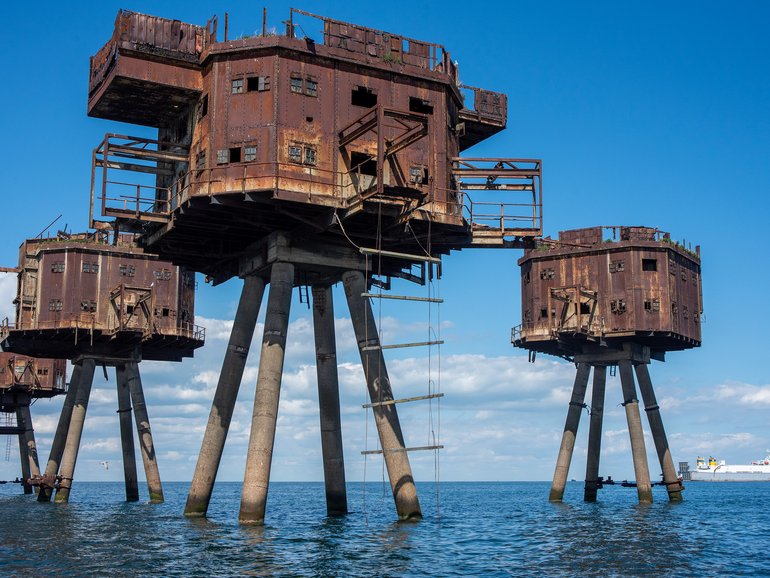 The rusting remains of the Maunsell Forts are seen close to the shore at Whitstable off the east coast of England.
