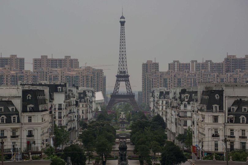 A replica of Paris in Tianducheng, a residential community build by Zhejiang Guangsha Co. Ltd in 2007, with a 108m meters Eiffel Tower replica in the heart of the city. The project expected to be completed by 2016, convinced only very few buyer and the residential city looks like more a ghost town than the original Paris. (Photo by Guillaume Payen/LightRocket via Getty Images)