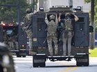 FBI agents were among the first responders after a shooting in Atlanta left a police officer dead. (AP PHOTO)