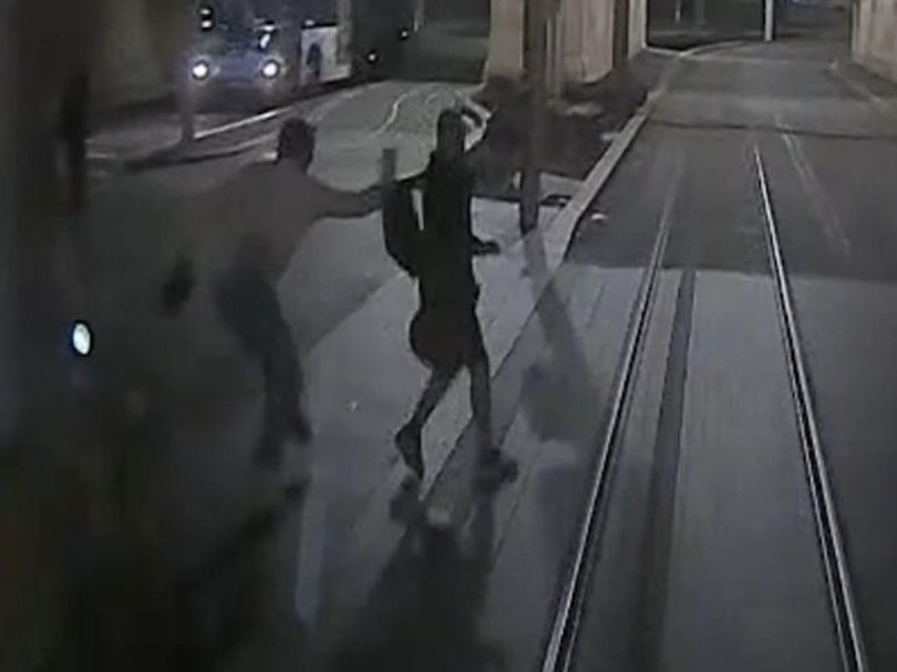 Footage has been released showing a man being saved from being hit by a Sydney tram by someone yanking them by their backpack. Picture: Supplied