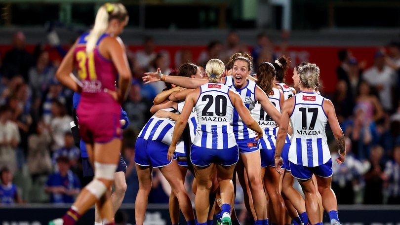 Kangaroos players celebrate victory on the final siren of the AFLW grand final at Ikon Park.