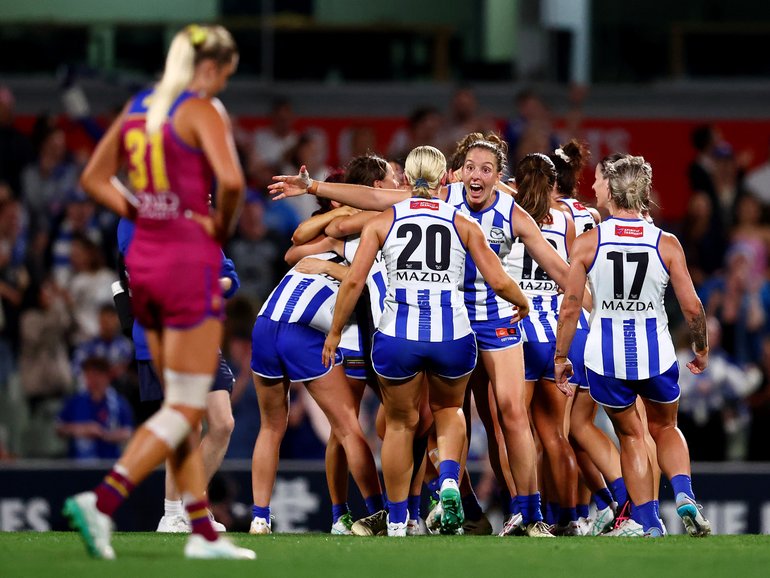 Kangaroos players celebrate victory on the final siren of the AFLW grand final at Ikon Park.
