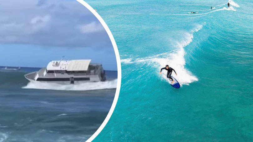 The disturbing moment a passenger ferry got smashed by a wave and careened into a popular surf spot in Hawaii has been caught on camera.