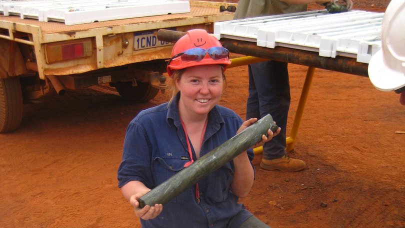 Margy Hawke inspects copper-rich massive sulphide in drill core trays from DeGrussa Unknown