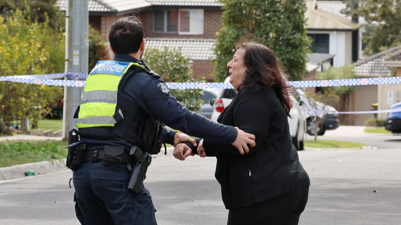 A distraught woman arriving at the scene on Tuesday.