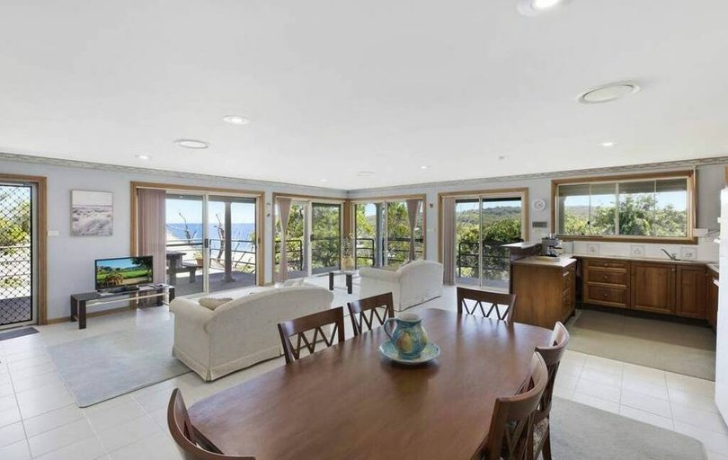 The house has an open-plan living, dining and kitchen area.