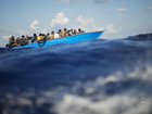 The Italian coast guard says at least 26 people have died after a boat carrying about 100 migrants capsized.