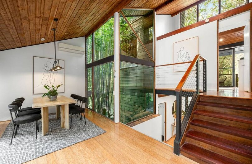 This home brings the outside in with its bibliophile design.