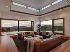 The modern conversation pit, or sunken lounge, is perfect for this resort-style home.