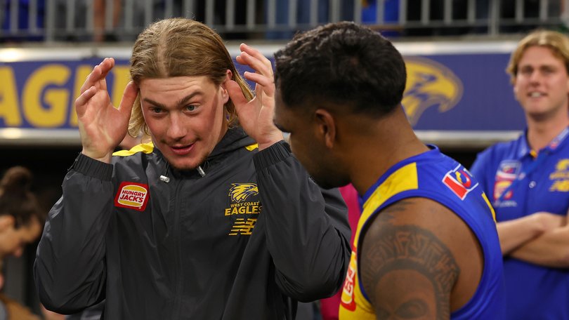 Harley Reid of the Eagles shares a moment with Liam Ryan.
