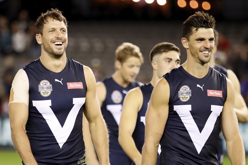 Travis Boak and Scott Pendlebury of Victoria are seen after a win during the 2020 State of Origin for Bushfire Relief.