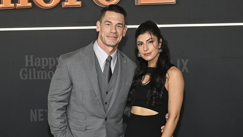 John Cena, with wife Shay Shariatzadeh, says he wishes he had a hair transplant a decade ago.