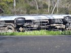 A mini bus carrying 25 people has rolled down an embankment in Williamstown, South Australia.