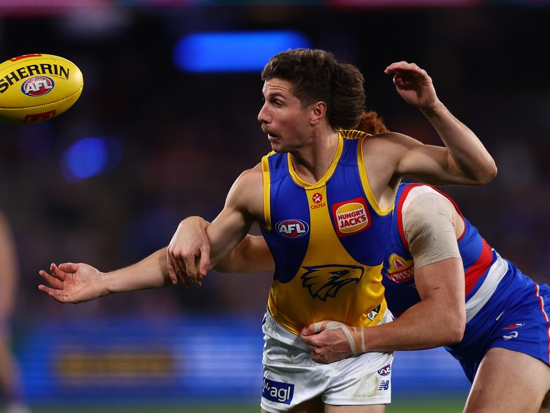 Liam Baker fights for the footy.