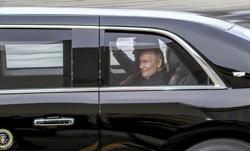 Vladimir Putin takes a ride in the Beast with Donald Trump as they make their way to official talks.