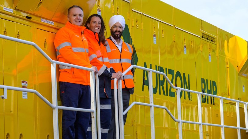 Aurizon chief executive Andrew Harding, BHP Copper SA asset president Anna Wiley and BHP group procurement officer Rashpal Singh Bhatti on board an Aurizon trail that carry the miner’s copper.