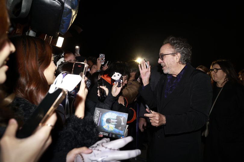 Tim Burton is greeted by fans in Sydney.