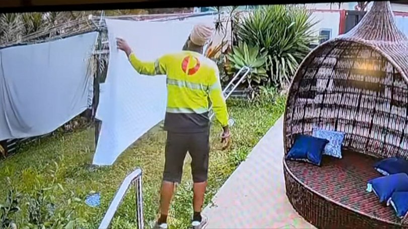 Singh was seen getting the sheets off the line in wet weather.