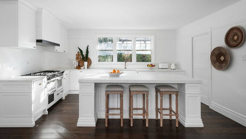 The couple installed a new gourmet kitchen as part of the renovation. Pic: Fredman.