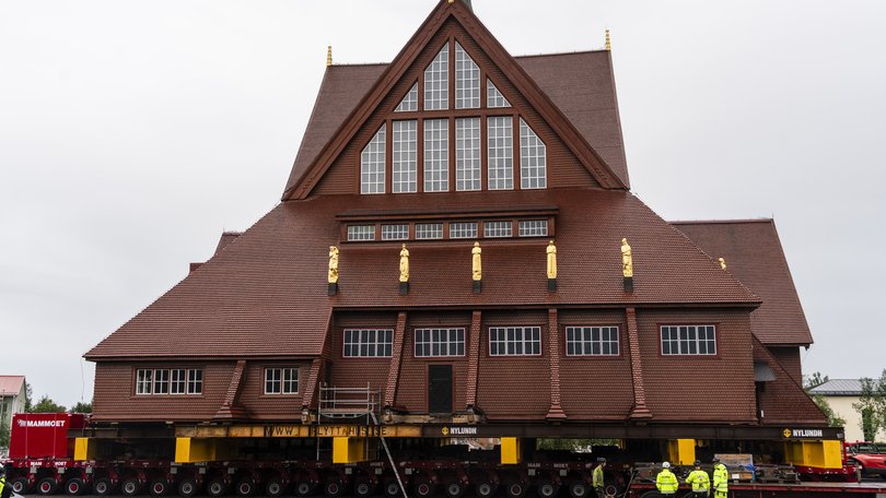 Workers perform final preparations on the church building on August 18, 2025 in Kiruna, Sweden.