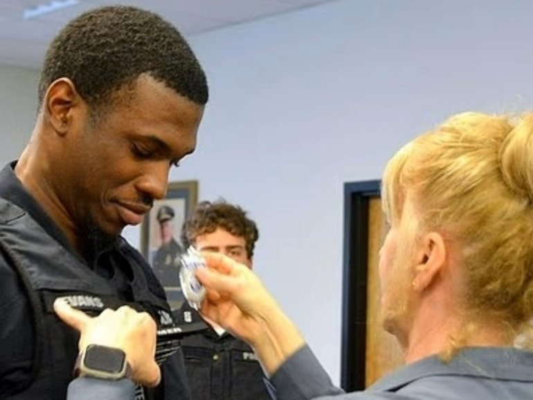 A man was arrested after working as a police officer while living in the US illegally.