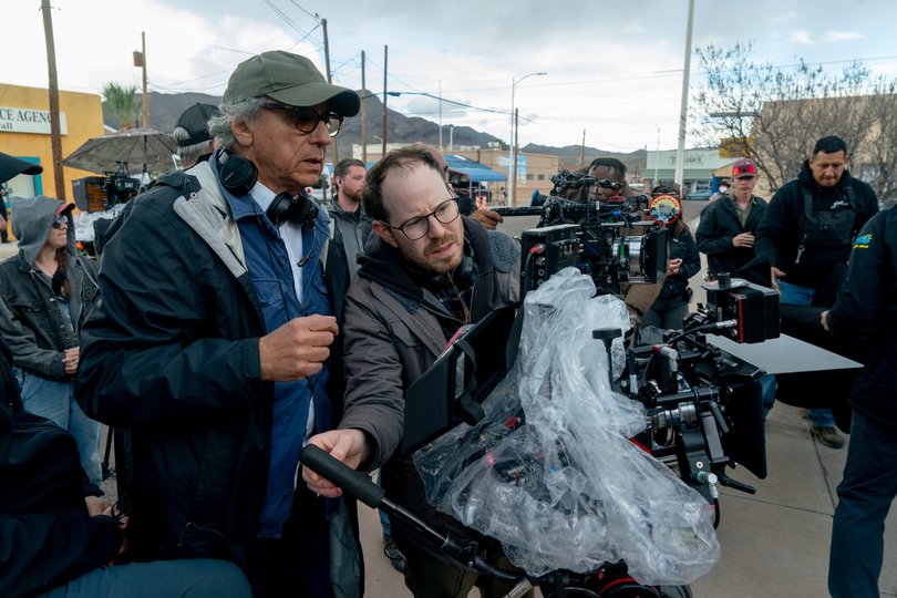 Ari Aster looks at the camera monitor on the set of Eddington.